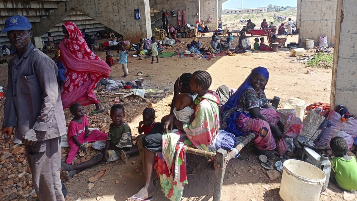 In this photo released by the NGO Mercy Corps, Sudanese families displaced by RSF attacks in Kordofan take shelter in a football stadium in Kadugli, South Kordofan province, Sudan, May 27, 2025. (Merc ...
