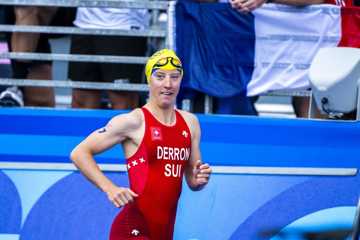 Julie Derron of Switzerland arrives for start of the women's triathlon competition at the 2024 Paris Summer Olympics in Paris, France, Wednesday, July 31, 2024. (KEYSTONE/Anthony Anex)