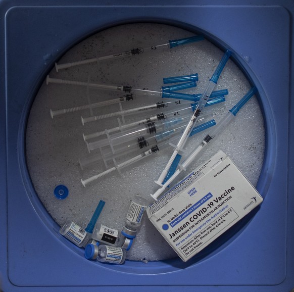 epa09354456 A health worker prepares a dose of Johnson and Johnson vaccine against COVID-19 for foreign employment workers at a vaccination center in Kathmandu, Nepal, 20 July 2021. Nepal started its  ...