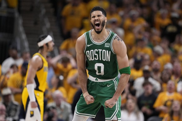 Boston Celtics forward Jayson Tatum (0) celebrates during the second half of Game 3 of the NBA Eastern Conference basketball finals against the Indiana Pacers, Saturday, May 25, 2024, in Indianapolis. ...