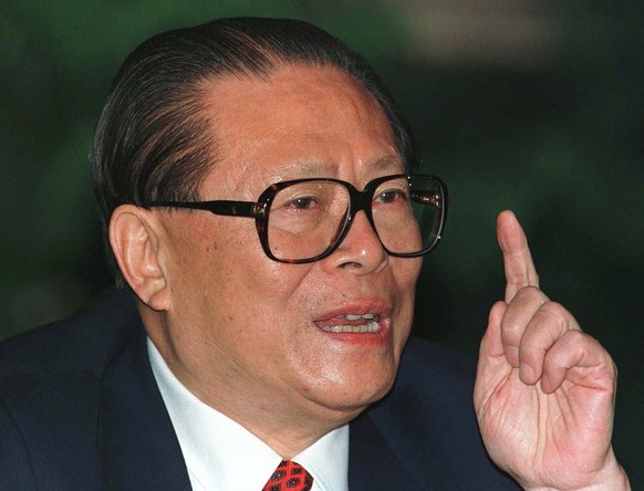 FILE - Chinese then President Jiang Zemin makes a point during a press conference in Beijing, one day before his departure for an eight-day visit to the U.S, Oct. 25, 1997. Jiang has died in Shanghai  ...