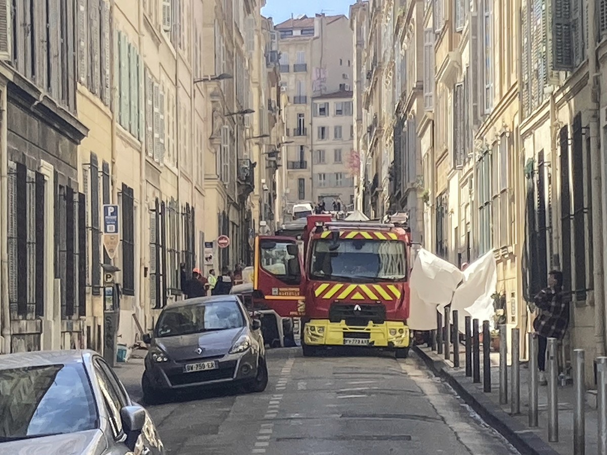 A fire truck is parked in a street near the scene where a building collapsed, in Marseille, southern France, April 10, 2023. French authorities said the death toll rose to four people after two bodies ...