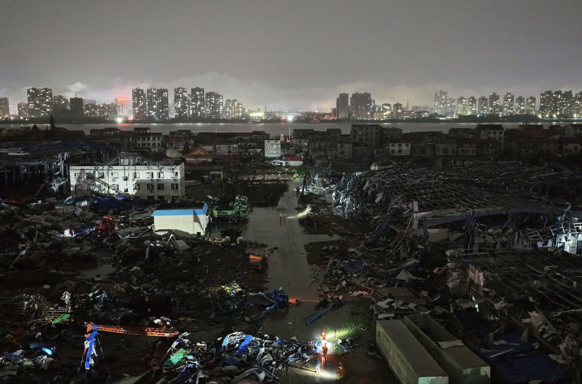 HUANGZHOU, CHINA - JULY 06: Armed police officers carry out rescue operations following a tornado on July 6, 2026 in Huangzhou, Huanggang, Hubei Province of China. Eleven people were killed and one re ...