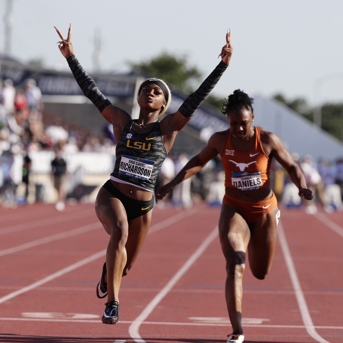 LSU's Sha'Carri Richardson, center, celebrates as she wins the women's 100 meters during the NCAA outdoor track and field championships in Austin, Texas, Saturday, June 8, 2019. (AP Pho ...
