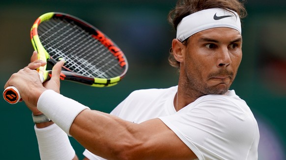 epa07699331 Rafael Nadal of Spain in action against Jo-Wilfried Tsonga of France during their third round match at the Wimbledon Championships at the All England Lawn Tennis Club, in London, Britain, ...