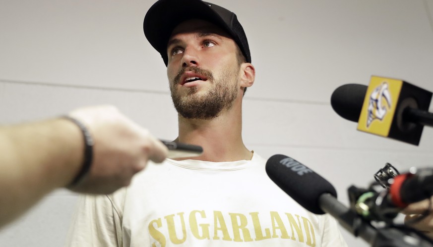 Nashville Predators defenseman Roman Josi, of Switzerland, answers questions as players report to NHL hockey training camp Thursday, Sept. 12, 2019, in Nashville, Tenn. (AP Photo/Mark Humphrey)
Roman  ...