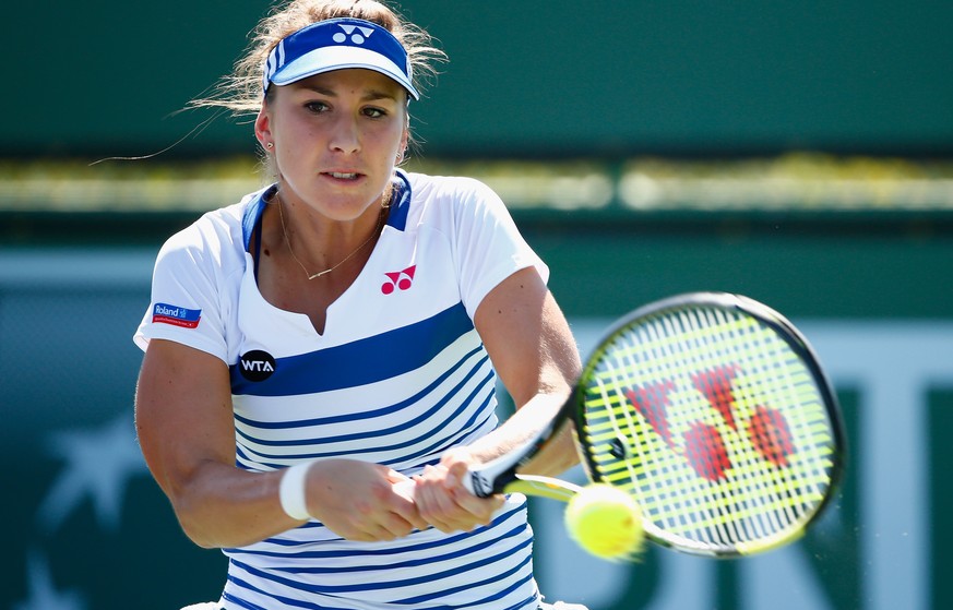 INDIAN WELLS, CA - MARCH 14: Belinda Bencic of Switzerland in action against Bojana Jovanovski of Serbia during day six of the BNP Paribas Open tennis at the Indian Wells Tennis Garden on March 14, 20 ...