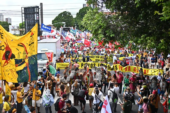 epa12527983 People join the Global Climate March in Belem, Brazil, 15 November 2025, calling on governments to protect forests, uphold indigenous rights, and take global climate action during the COP3 ...