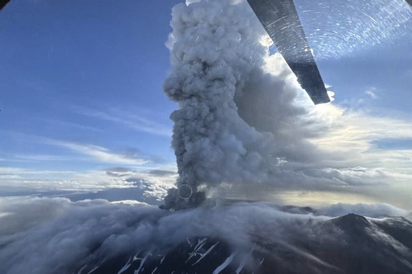 KEYPIX - epa12281417 A handout photo made available by the Institute of Volcanology and Seismology FEB RAS shows the Krasheninnikov Volcano spewing smoke and ash during an eruption in the Kamchatka Te ...