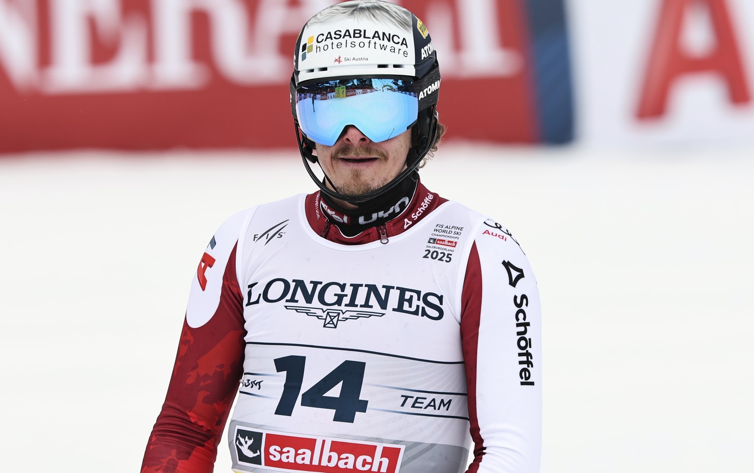 Austria's Manuel Feller checks his time at the finish area of a slalom run of a men's team combined event, at the Alpine Ski World Championships, in Saalbach-Hinterglemm, Austria, Wednesday, ...