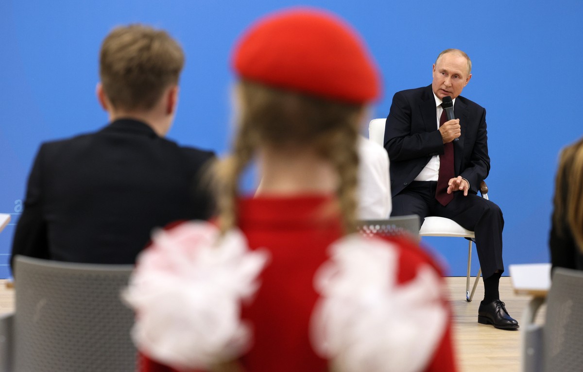 epa10152578 Russian President Vladimir Putin (R) holds an open lesson 'Talking about the important', which was attended by the winners of olympiads and competitions in the field of culture,  ...
