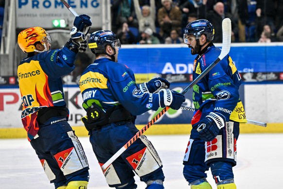 Isacco Dotti (HCAP) right celebrates his goal with PostFinance Top Scorer Michael Joly (HCAP) left and Manix Landry (HCAP) center, during the regular season National League game between HC Ambri Piott ...