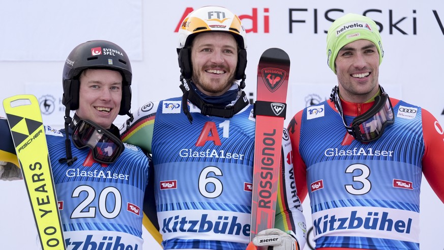 Germany&#039;s Linus Strasser, center, winner of an alpine ski, men&#039;s World Cup slalom race, celebrates on the podium with second-placed Sweden&#039;s Kristoffer Jakobsen, left, and third-placed  ...