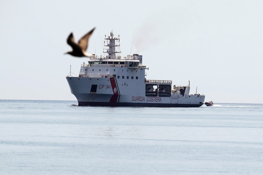 epa06883438 Italian Coast Guard ship Diciotti with 67 migrants on board enters the port of Trapani, Sicily, Italy, 12 July 2018. According to reports, the migrants were rescued by a civilian ship, the ...