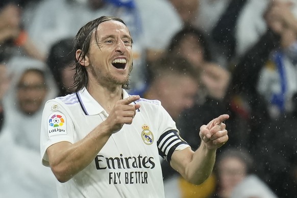 Real Madrid&#039;s Luka Modric celebrates after scoring the opening goal during the Spanish La Liga soccer match between Real Madrid and Sevilla at the Santiago Bernabeu stadium in Madrid, Saturday, O ...