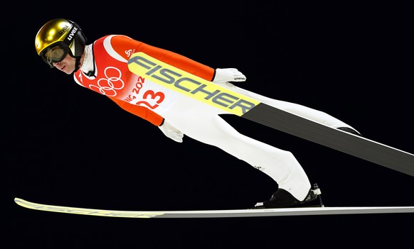 epa09749188 Simon Ammann of Switzerland in action during the trial round of the Men&#039;s Ski Jumping Large Hill final at the Zhangjiakou National Ski Jumping Centre at the Beijing 2022 Olympic Games ...