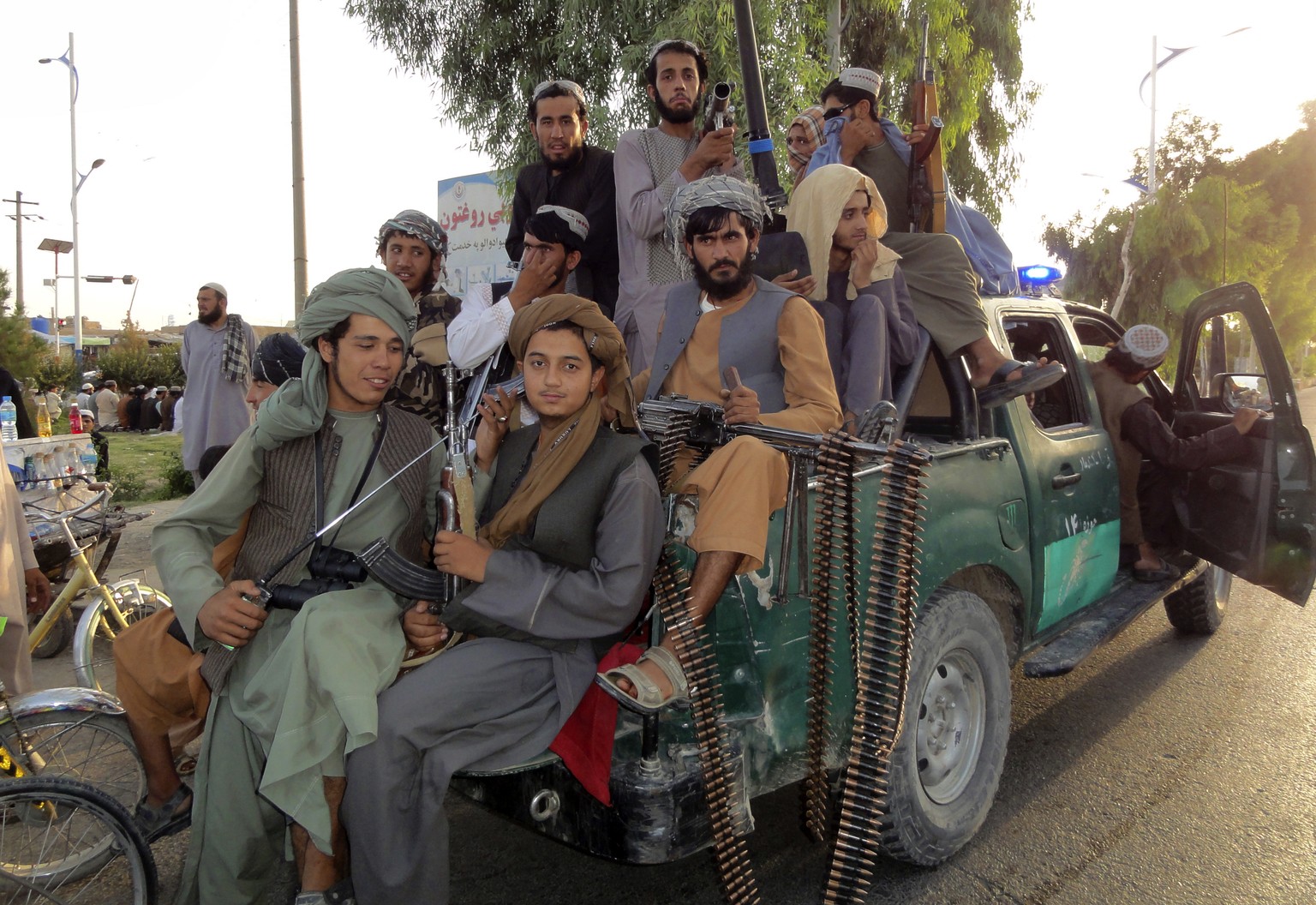 Taliban fighters patrol inside the city of Kandahar province southwest, of Afghanistan, Sunday, Aug. 15, 2021. (AP Photo/Sidiqullah Khan)