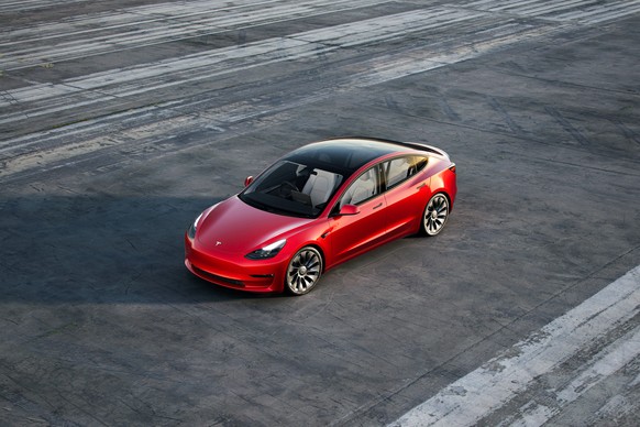 This photo provided by Tesla shows the 2021 Tesla Model 3, an all-electric compact sedan that has a range of over 270 miles and can receive over-the-air updates to add functionality. (Tesla Motors via ...