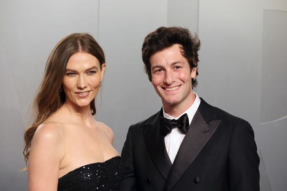 epa12826548 US model Karlie Kloss (L) and US venture capitalit Joshua Kushner (R) arrive at the 2026 Vanity Fair Oscar Party following the 98th annual Academy Awards ceremony at Los Angeles County Mus ...
