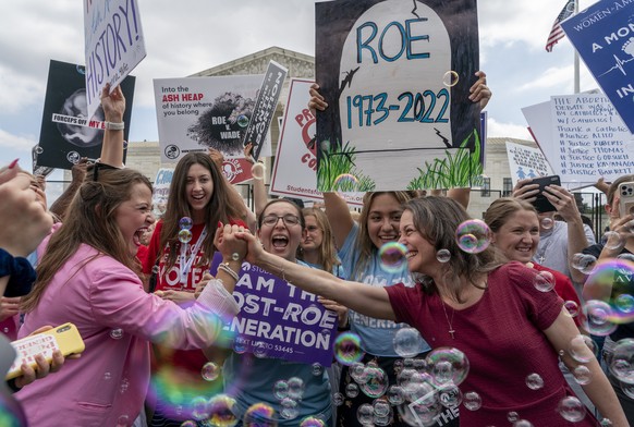 Anti-abortion protesters celebrate following Supreme Court&#039;s decision to overturn Roe v. Wade, federally protected right to abortion, outside the Supreme Court in Washington, Friday, June 24, 202 ...