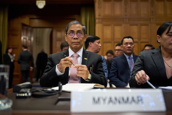 epa12644418 Ko Ko Hlaing (L) Myanmar's Minister of International Cooperation, attends the first hearing in which Myanmar is accused of committing genocide against the country's Muslim minori ...