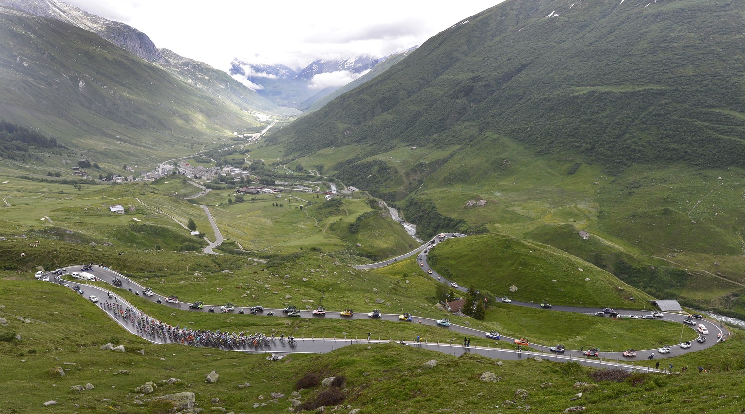 The pack climbs up the Furka pass during the 2nd stage, a 181,8 km race, from Bellinzona to Sarnen, at the 78th Tour de Suisse UCI ProTour cycling race, in Sarnen, Switzerland, Sunday, June 15, 2014.  ...
