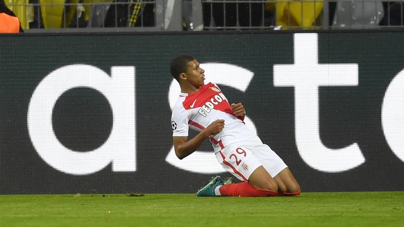 Monaco&#039;s Kylian Mbappe celebrates after scoring the opening goal during the Champions League quarterfinal first leg soccer match between Borussia Dortmund and AS Monaco in Dortmund, Germany, Wedn ...