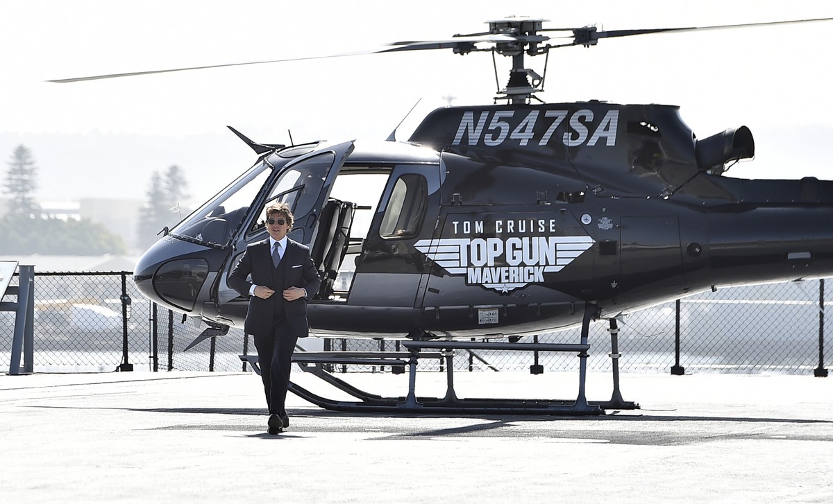 Tom Cruise walks to the red carpet after riding a helicopter to the world premiere of "Top Gun: Maverick" on Wednesday, May 4, 2022, at the USS Midway in San Diego. (Photo by Jordan Strauss/ ...