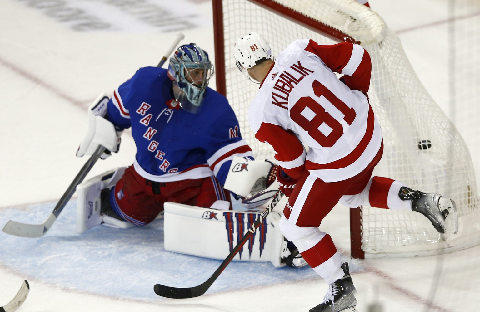 Detroit Red Wings left wing Dominik Kubalik (81) watches his winning overtime goal hit the back of the net as New York Rangers goalie Jaroslav Halak looks back during the third period of an NHL hockey ...