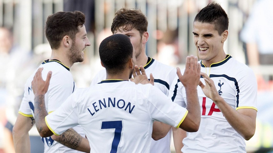 Tottenham Hotspur&#039;s Erik Lamela, right, celebrates his first goal of a friendly soccer game with teammates, from left to right, Ryan Mason, Aaron Lennon and Ben Davies during the first half again ...