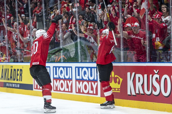Switzerland`s Sven Andrighett, right, celebrate after scoring 1:0 during the game between Sweden and Switzerland, at the IIHF 2019 World Ice Hockey Championships, at the Ondrej Nepela Arena in Bratisl ...