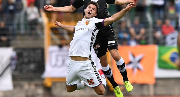 Lugano&#039;s player Fulvio Sulmoni, right, fights for the ball with Basel&#039;s player Andraz Sporar, left, during the Super League soccer match FC Lugano against FC Basel, at the Cornaredo stadium  ...