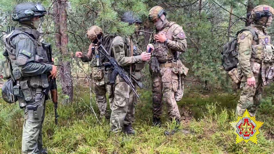 FILE - In this grab taken from video released by Belarus&#039; Defense Ministry on Thursday, July 20, 2023, Belarusian soldiers of the Special Operations Forces (SOF) and mercenary fighters from Wagne ...