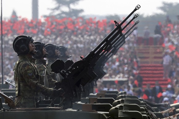 Army vehicles roll down during a parade to commemorate the 70th anniversary of the founding of Communist China in Beijing, Tuesday, Oct. 1, 2019. (AP Photo/Ng Han Guan)