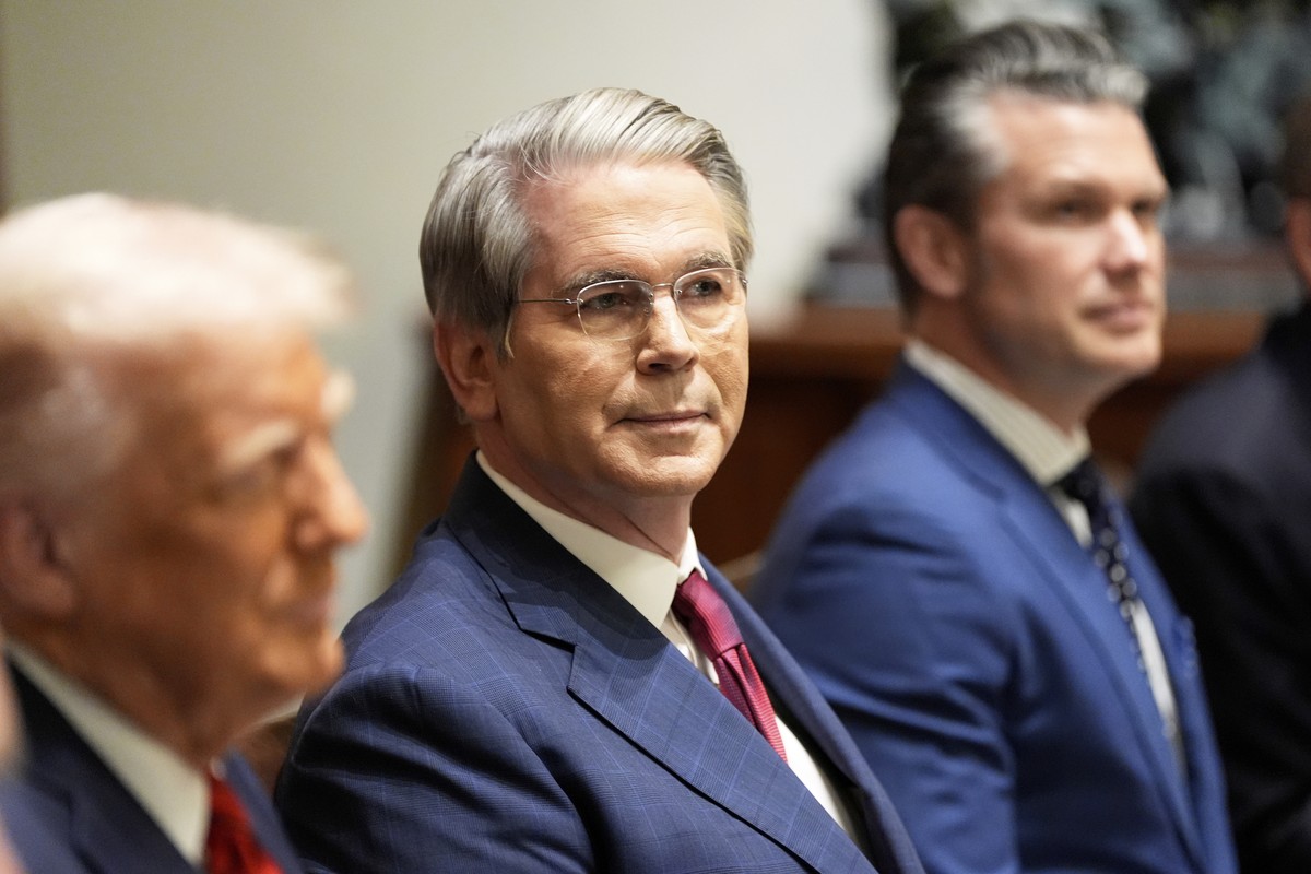 Treasury Secretary Scott Bessent and Defense Secretary Pete Hegseth listen as President Donald Trump speaks before a luncheon with Italy's Prime Minister Giorgia Meloni in the Cabinet Room of the ...