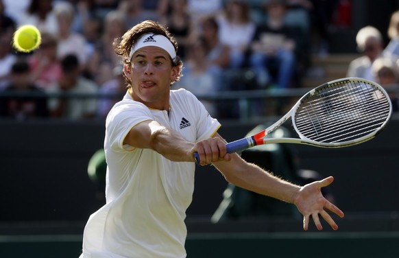 Austria&#039;s Dominic Thiem returns to Canada&#039;s Vasek Pospisil during their Men&#039;s Singles Match on day two at the Wimbledon Tennis Championships in London Tuesday, July 4, 2017. (AP Photo/K ...