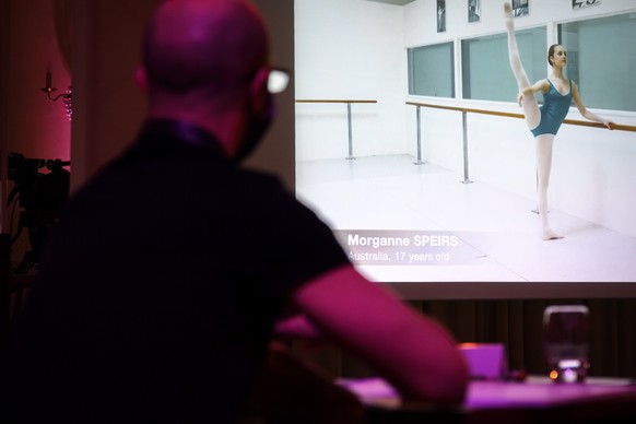 epa08981781 Jury members look at a screen video submission of Autralian dancer Morganne Speirs performing during the second day of the video edition of the 49th Prix de Lausanne, during the coronaviru ...