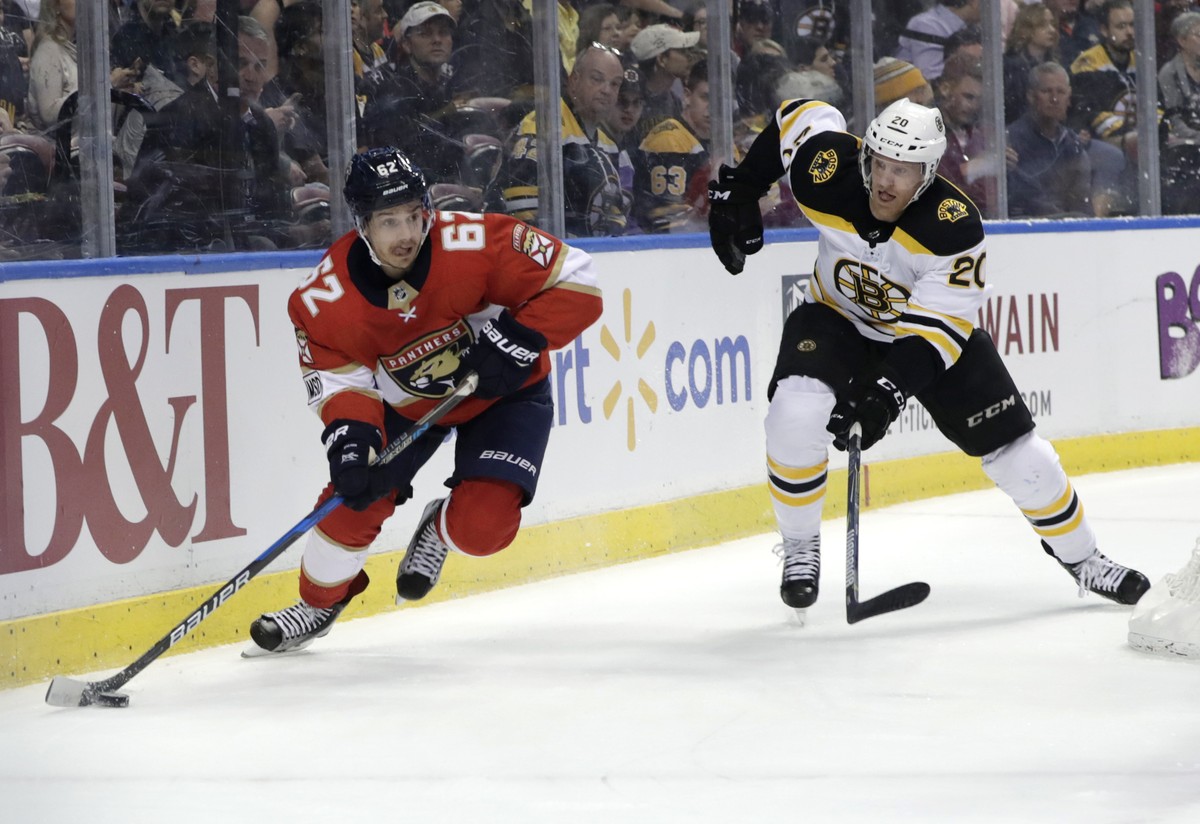 Florida Panthers' Denis Malgin (62) skates with the puck as Boston Bruins' Riley Nash (20) defends during the first period of an NHL hockey game, Thursday, March 15, 2018, in Sunrise, Fla. ( ...
