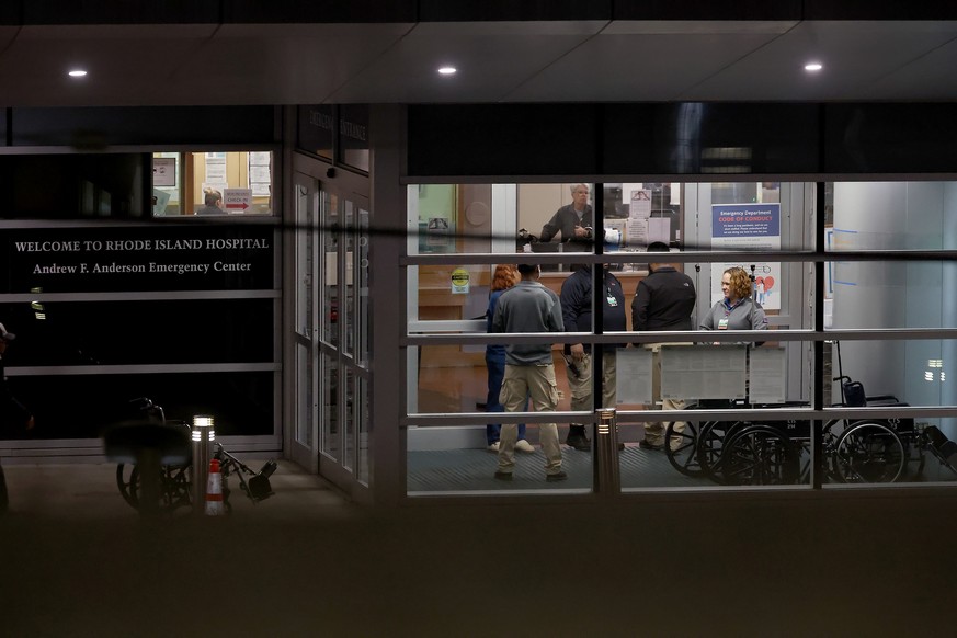 People stand at an entrance to Rhode Island Hospital in Providence, R.I., on Saturday, Dec. 13, 2025, where victims from a shooting at Brown University were transported. (AP Photo/Mark Stockwell)
Brow ...