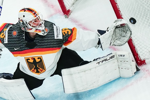 Germany&#039;s goalie Mathias Niederberger makes a save during the group A match between Denmark and Germany at the ice hockey world championship in Tampere, Finland, Thursday, May 18, 2023. (AP Photo ...