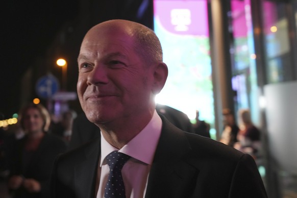 Olaf Scholz, Finance Minister and SPD candidate for Chancellor, leaves after attending a TV broadcast on the parliamentary elections in Berlin, Sunday, Sept. 26, 2021. Exit polls show the center-left  ...