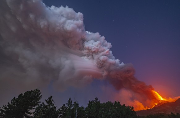 Smoke billows from the Mt Etna volcano as seen from Linguaglossa, Sicily, Monday, Aug. 9, 2021. Europe&#039;s most active volcano remains active scattering ashes around a vastly populated area on its  ...