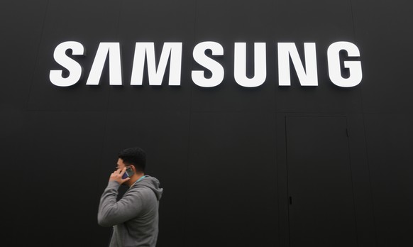 A person walks by a logo of Samsung Electronics at an exhibition hall for the Asia-Pacific Economic Cooperation (APEC) in Gyeongju, South Korea, Thursday, Oct. 30, 2025. (AP Photo/Lee Jin-man)
South K ...