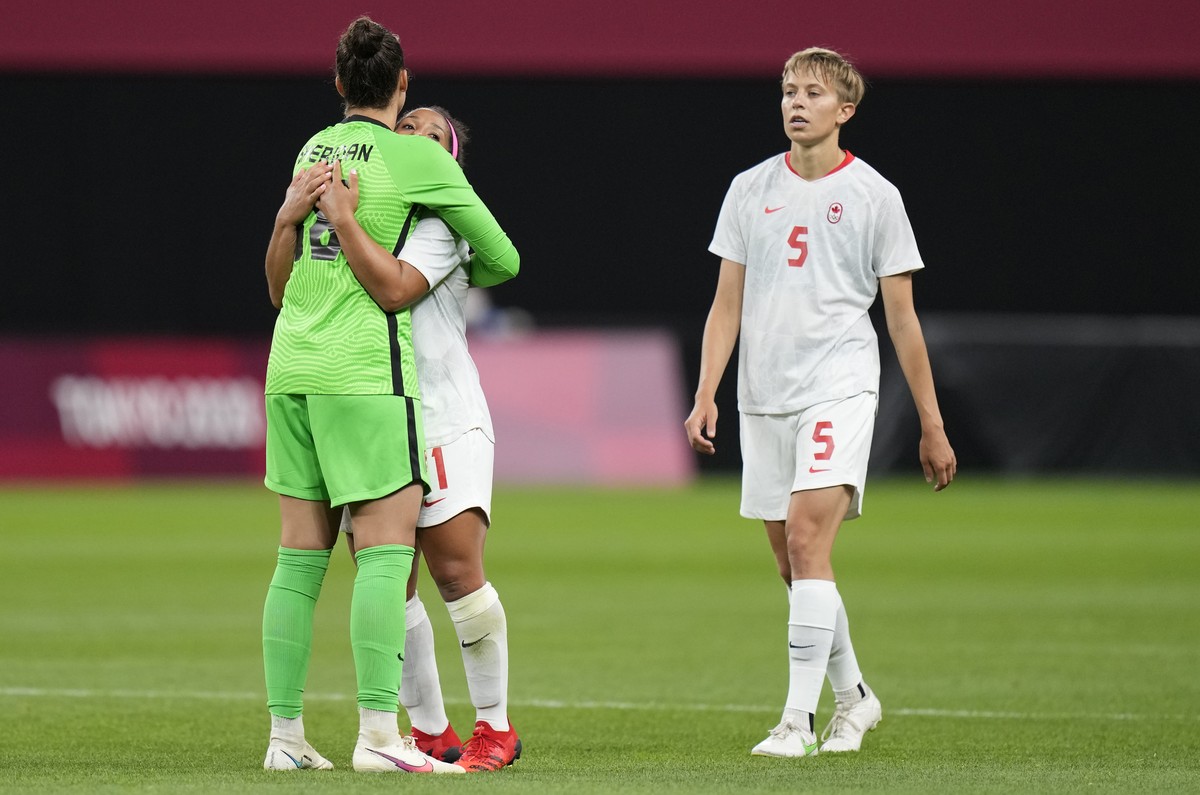 Canada's Quinn, right, leaves the field celebrate at the end of a women's soccer match against Chile at the 2020 Summer Olympics, Saturday, July 24, 2021, in Sapporo, Japan. Canada won 2-1.( ...