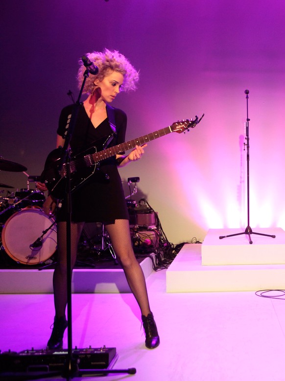 NEW YORK, NY - FEBRUARY 09: Singer/musician St. Vincent (L) and guitarist/mini moog player Toko Yasuda perform at the American Express UNSTAGED Fashion with DVF at Spring Studios on February 9, 2014 i ...
