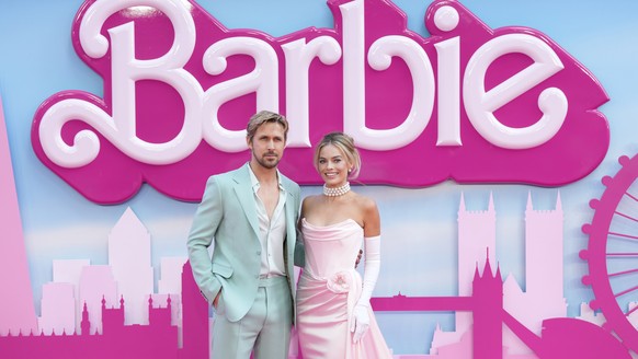 FILE - Ryan Gosling, left, and Margot Robbie pose for photographers upon arrival at the premiere of the film &#039;Barbie&#039; on July 12, 2023, in London. ?Barbie? is set to open across the Middle E ...