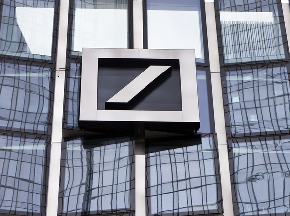 FILE - The Deutsche Bank logo is displayed in a bank's building in Frankfurt, Germany, April 9, 2018. Shares in Deutsche Bank, Germany's largest lender, have fallen sharply, making large…