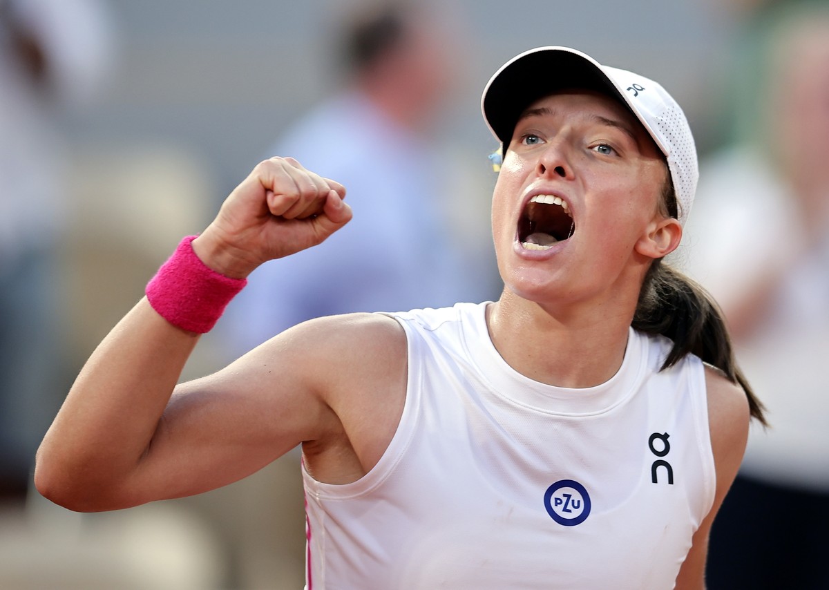 epa10680321 Iga Swiatek of Poland reacts after winning against Beatriz Haddad Maia of Brazil in their Women's semi final match during the French Open Grand Slam tennis tournament at Roland Garros ...