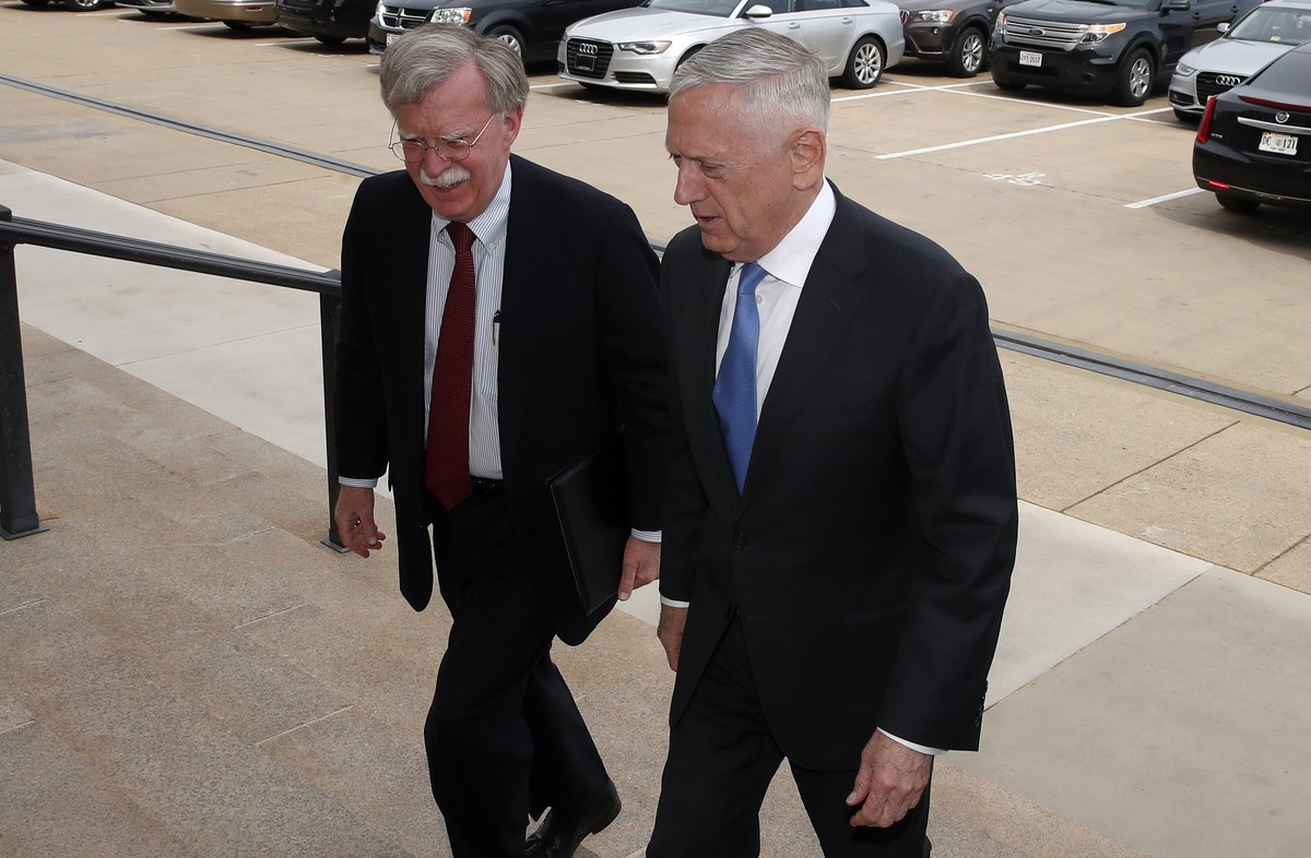 President Donald Trump's pick for national security adviser John Bolton, left, walks up the steps with Defense Secretary Jim Mattis, as Bolton arrives at the Pentagon, Thursday, March 29, 2018, i ...