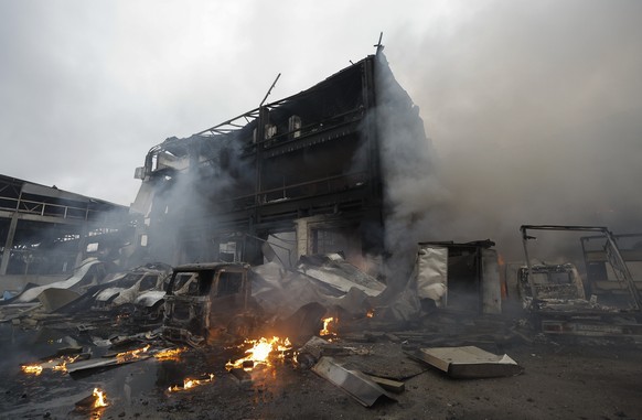 epa12480992 Damage at the site of a Russian missile strike in Kyiv, Ukraine, 25 October 2025, amid the Russian invasion. At least two people were killed and 13 others injured after Russian forces laun ...